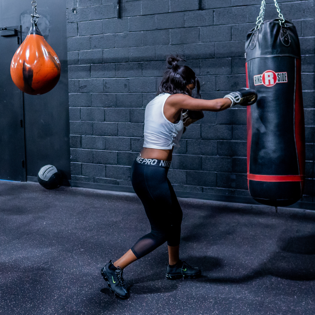 woman boxing punch bag